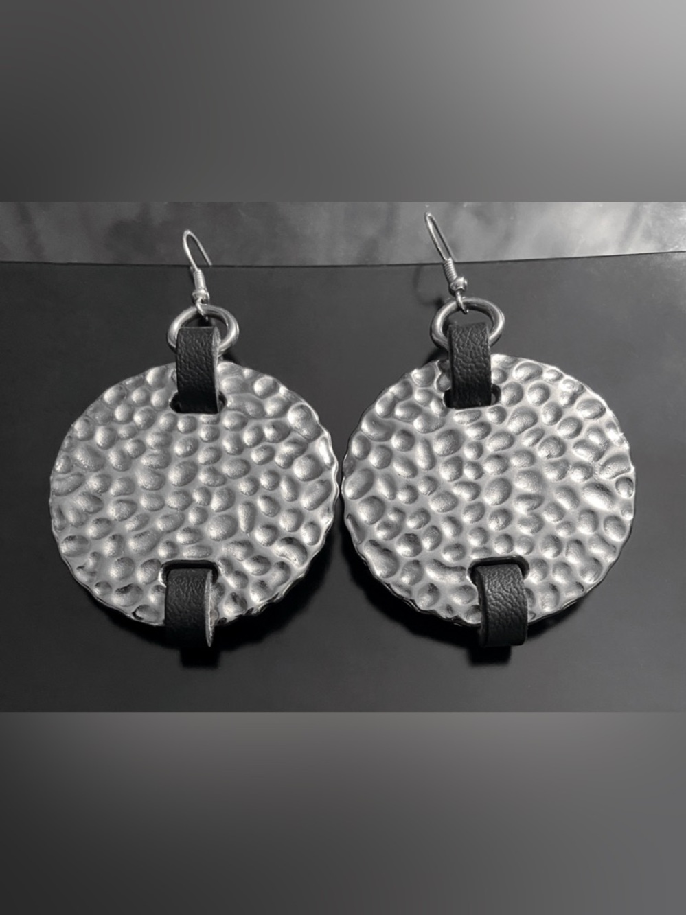 Hammered Silver-Tone Disc Earrings with Black Straps